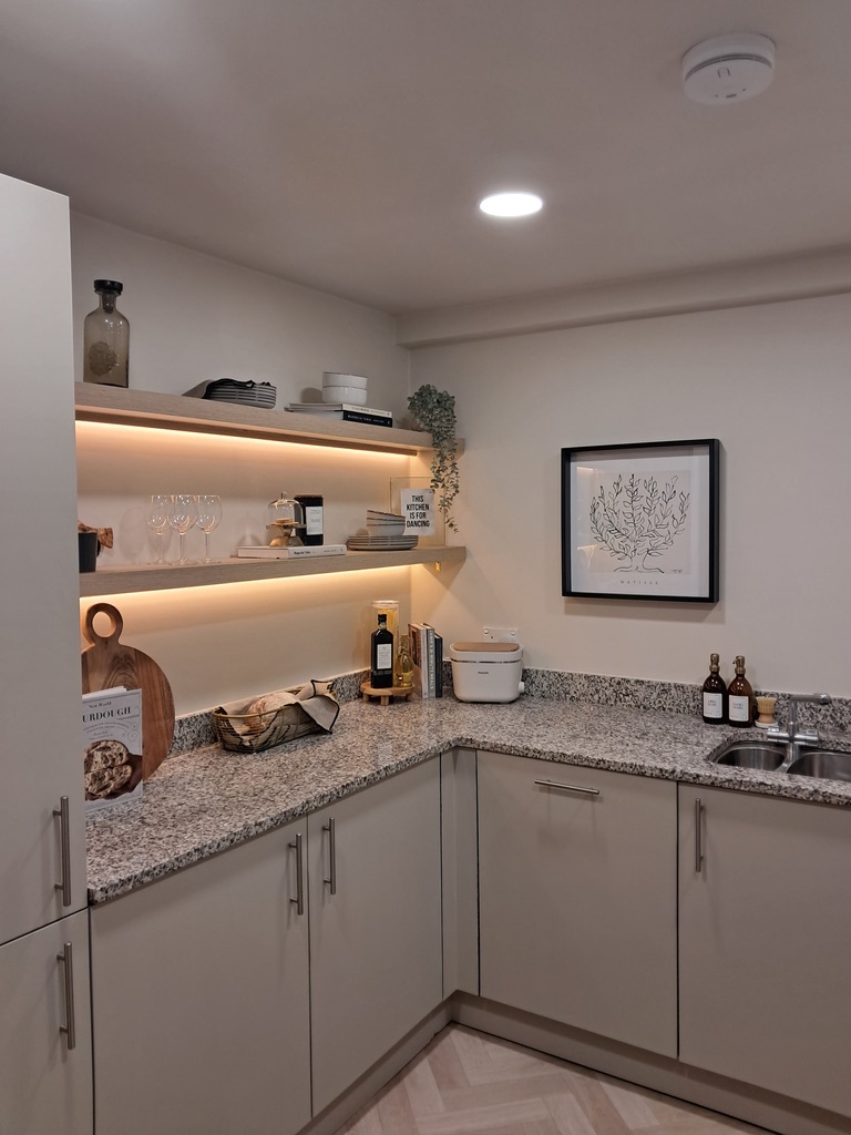 Newly fitted kitchen with stone worktops, integrated appliances and under-shelf lighting in an Oxfordshire rental property
